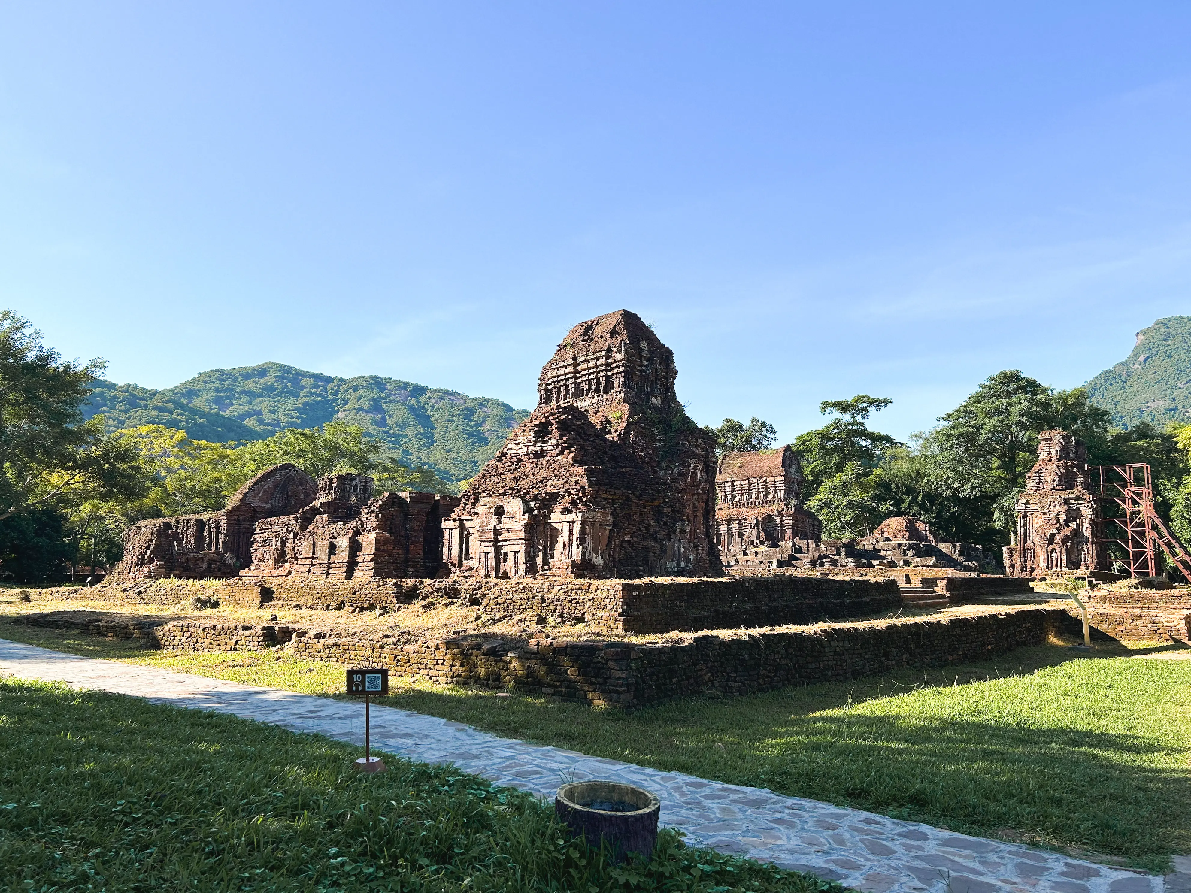 Panoramic view of the sanctuary showing the valley setting and multiple temple groups