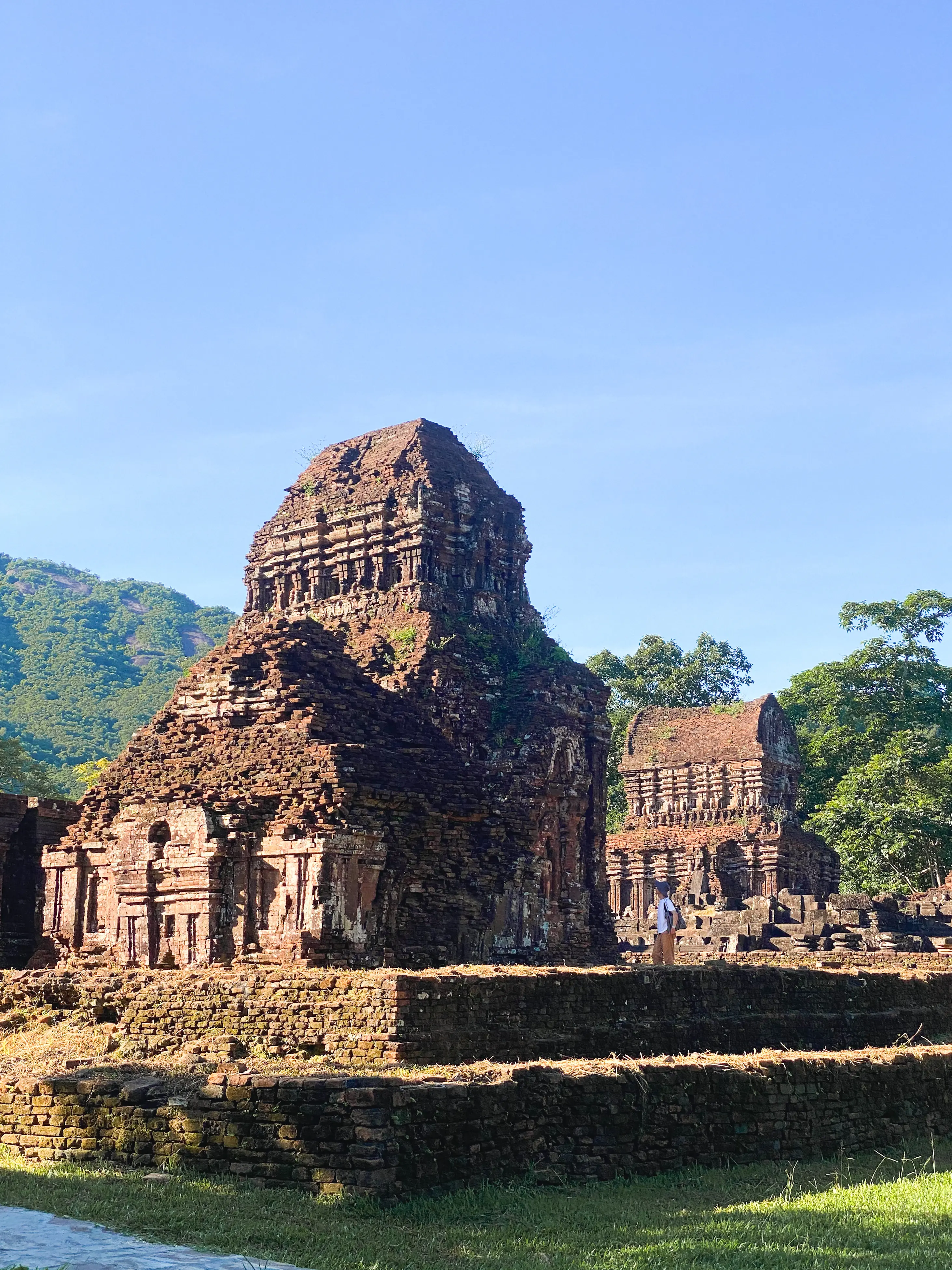 Temple group B showing the characteristic red brick construction and surrounding jungle setting